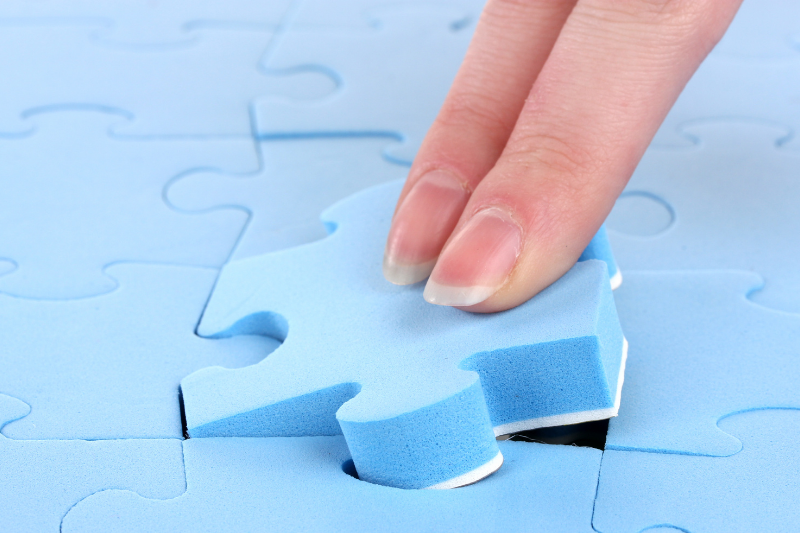 Woman completing a puzzle